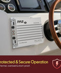 Hydra Marine 400W 4 Channel Amplifier Waterproof installed on boat dashboard near steering wheel for secure audio operation