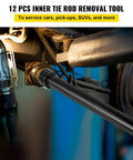 Inner tie rod removal tool, black steel, installed in a vehicle's tie rod end