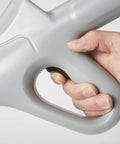 Close-up of hand gripping High Pressure Air Drain Plunger For Quick Toilet Clogs And Drain Unclogging Easy To Use No Plumber Needed