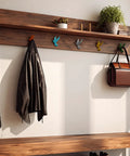 Set Of Six Slick Flying Bird Cast Iron Wall Hooks Featuring Hella Distressed Rustic Finish, displaying coats and bags.
