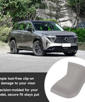 SUV parked outdoors with text overlay about Sun Visor Cap Clip 964203JA0A for Nissan Pathfinder Altima Murano Rogue Maxima in grey plastic.