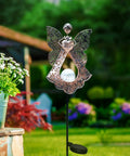 Solar Stake Lights For Garden In Metal Angel Bronze Finish, Warm White LEDs in garden setting, outdoor memorial light.