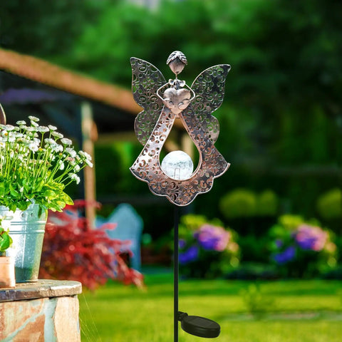 Solar Stake Lights For Garden In Metal Angel Bronze Finish, Warm White LEDs in garden setting, outdoor memorial light.