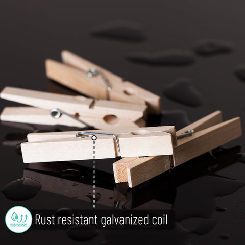 Large Wooden Clothes Pins 2.9 Inch 50 Pack Built Tough Galvanized Coil Springs shown on black surface with water droplets.