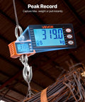 Beast Of A Digital Crane Scale With 4400 Lbs Capacity, LCD display reading 319 kg, hanging from a hook, in industrial setting.