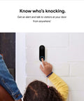 Child reaching to press Wired Video Doorbell Cam With Always On Streaming HDR Video Night Vision And Two Way Talk For Your Front Door Real Time Person Alerts Easy Setup Works With Your Smart Home Devices Secure Home Monitoring installed on white brick wall