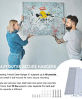 Heavy Duty French Cleat Picture Hanger Kit With Stealth Aluminum Wall Brackets For Artwork Mirrors And Whiteboards Holds 50 Pounds Per Pair No Sweat Install, couple mounting a large painting.