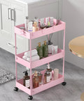 Three Tier Rolling Cart With Wheels Storage Organizer With Casters 3 Hanging Baskets Easy Assembly Perfect For Kitchen Office Living Room Laundry Pink displaying toiletries in a bathroom.