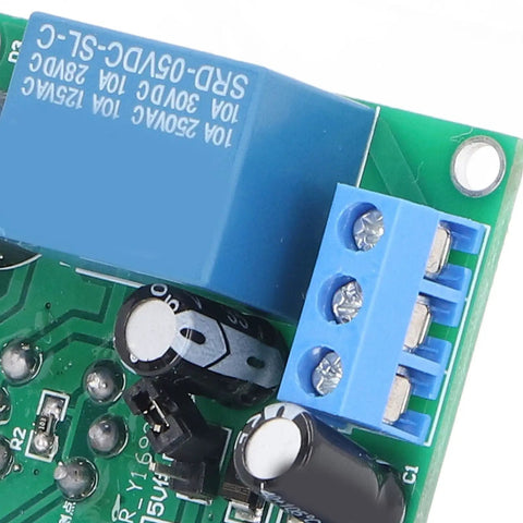 Plug And Play Smoke Sensor Module With Adjustable Threshold And Cranking Buzzer circuit board close-up, with blue relay and capacitors.