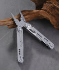 All In One Multitool Pliers With Replaceable Wire Cutters And Glass Hammer Premium Steel Construction on stone surface