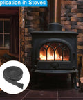 Front view of black wood stove with glass door; inset shows coil of flat graphite fiberglass gasket rope for stoves.