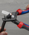 StepCut XL Cable Shears 9 Inch With High Leverage Joint And Comfort Handles cutting copper wire close-up.