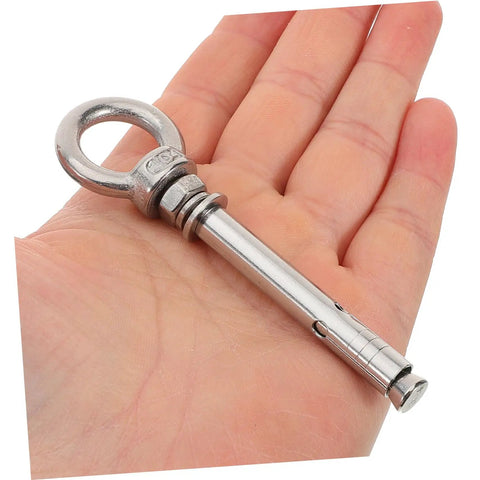 Heavy Duty Stainless Steel Eye Bolts Hanger Kit 5 Piece For Secure Lifting And Suspension Ideal For Yoga Swings Hammocks And Heavy Equipment Installations Durable Easy To Install Safety Hardware, one anchor bolt in hand
