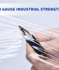 Close-up of Heavy Duty Pro Grade 60 Gauge Stretch Wrap Film 4 Inch By 1000 Foot Roll With Handle being punctured by a pen