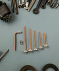 49 Piece M6 X 40-80mm Hex Socket Furniture Screw And Barrel Nut Set for DIY projects, surrounded by various tools.