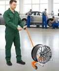 Mechanic using Beefy Heavy Duty Tire Dolly For Garage And Auto Repair Wheel Tire Moving Cart in auto shop