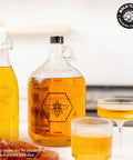 Mead Making Kit For Beginners All In One Home Brewing Starter with 1 Gallon Glass Carboy and filled glasses