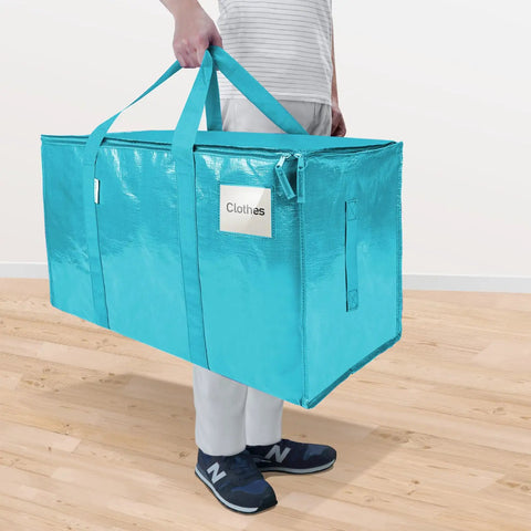 Person carrying Extra Large Moving Bags With Zippers And Handles Heavy Duty Waterproof Storage Bags For Closet Organization 27x14x15 Inches 24 Gallon 120 Lb Load 4 Pack