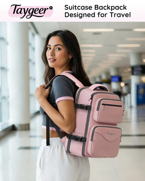 Woman at airport with pink Under Seat Personal Item Bag For Travel TSA Approved 18x14x8 Inches With Water Bottle Pocket And Shoe Compartment Fits 15.6 Inch Laptop Pink For Women Go To Travel Buddy Carry On Backpack.