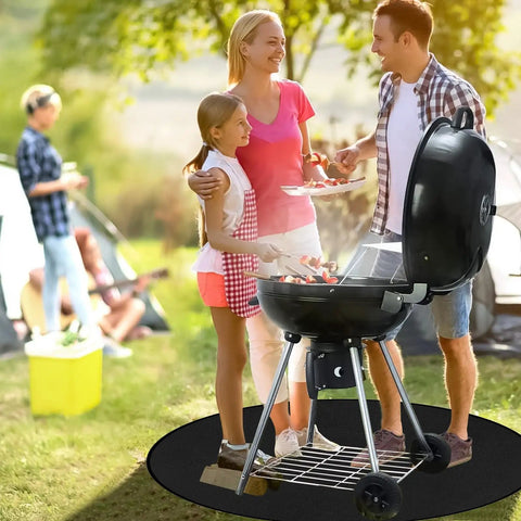 Family grilling outside on 38-Inch Fire Pit Mat For Bonfires And Grills, Round Fireproof And Oil-Proof Deck Protector For Outdoor Patio And Lawn