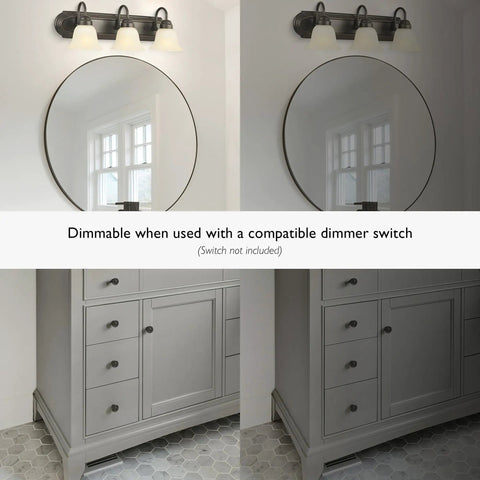 Three Light Dimmable Vanity Light In Oil Rubbed Bronze With Frosted Glass Shades, showcased over a bathroom mirror, showing dimmability.