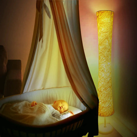 Smart RGB Floor Lamp With Music Sync And 16 Million DIY Colors, casting warm light near a sleeping baby in a bassinet.