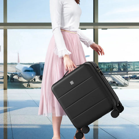 Woman holding 16 Inch Underseat Carry On Luggage With Wheels Hard Shell Mini Suitcase For Airline Travel TSA Approved Lightweight Black