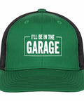 Green breathable low profile trucker cap for men with adjustable buckle, text 'I'll Be In The Garage' on front, perfect for outdoor adventures.