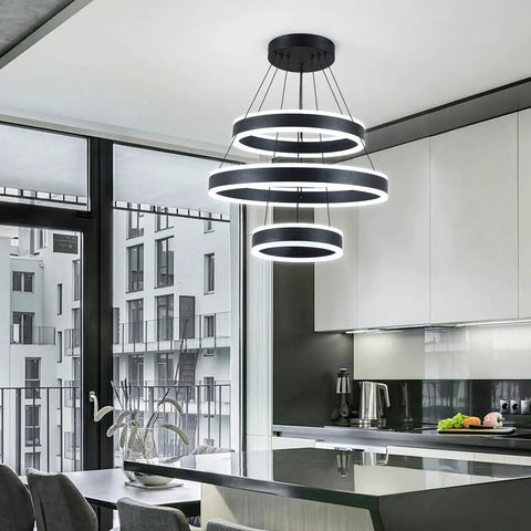Modern Black LED Ring Chandelier With Three Adjustable Tiered Cylinders Hangs Flawlessly Over Kitchen Islands Or Bedrooms Quick Install Setup in a sleek kitchen.