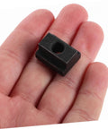 Hand holding a component of the Six Piece Slot Fastening Nuts And Bolts Set For T Slot Tracks And Machine Tool Applications