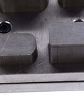 Close-up of Durable Alloy Disc Cutter Set For Jewelry Making and Metal Crafting, showing irregular shape punches on steel base.