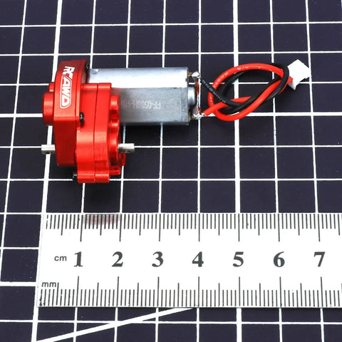 55T Brushed Motor And 88T Transmission Upgrade For 1 24 Scale SCX24 on grid with ruler, showing size and details of unit