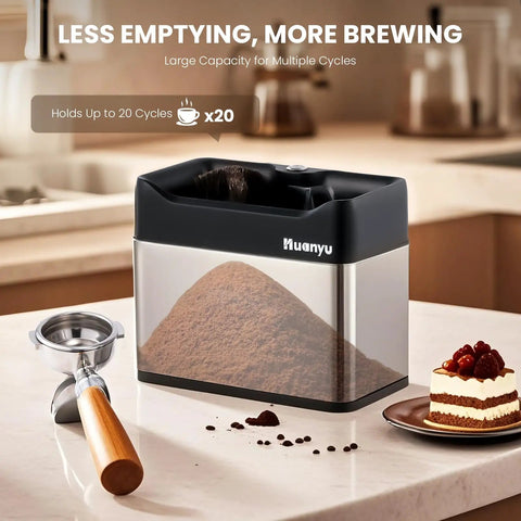 Automatic Portafilter Washer With Three Liter Tank Efficient Three Way Valve Rapid Drainage Fits 51 And 58 Millimeter Espresso Machines stainless steel portafilter cleaner with ground coffee on countertop.