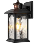 Black wall-mounted Motion Sensor Outdoor Wall Lantern with Dusk To Dawn Sensor, featuring water rippled glass and PIR detection.