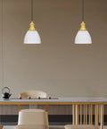 Dining room view with Two of Three Pack Hanging Kitchen Island Pendant Lights In Gold With Frosted Glass Shade, 6.5 Inch Wide shown.