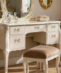 Brushed Gold Bow Dresser Knobs Set Of 8 on antique white vanity in elegant room