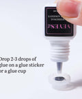 Applying Extra Strong Lash Extension Glue 5ml For Pros Fast 0.5 To 1 Second Dry Time Black Adhesive into a cup