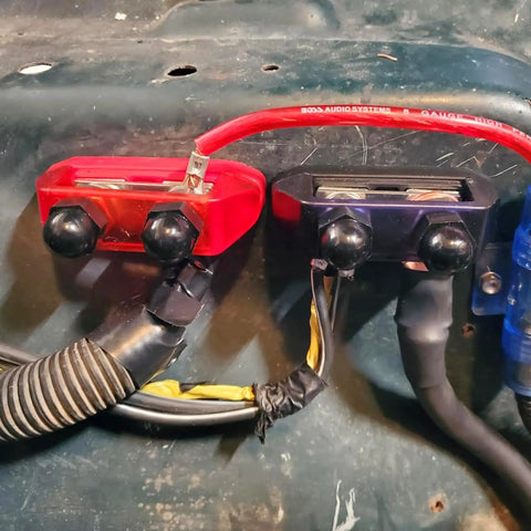 Ridiculously Strong 3/8 Power Distribution Block Bus Bar Offering Dead Serious Two Hundred Fifty Amps And Dual M10 Studs installed on a panel.