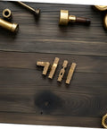 Small Solid Brass Invisible Barrel Hinges For Jewelry Boxes And Cabinet Doors on wooden surface