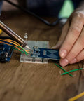 Hands using 2 To 125 mm Breadboard Jumper Wires Kit With 14 Lengths And 840 Pieces For Quick Prototyping Maker Friendly PCB Circuits