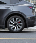 Ride Ready 4 Piece Wheel Covers For Tesla Model Y Juniper 19 Inch on a sleek black Tesla with aero hubcap design.