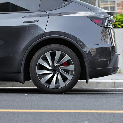 Ride Ready 4 Piece Wheel Covers For Tesla Model Y Juniper 19 Inch on a sleek black Tesla with aero hubcap design.