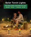 Outdoor camp scene with 8 Pack 12 LED Solar Torch Lights With Flickering Flame illuminating garden pathway, lawn, yard, patio.