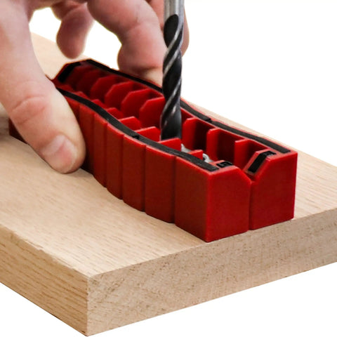 Drill Block Plus Handheld Drilling Guide for DIYers aligned on wood with drill bit, showing nine imperial drill bit sizes.