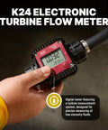K24 Electronic Turbine Flow Meter held in hand, measuring low viscosity fluids with digital display and robust design.