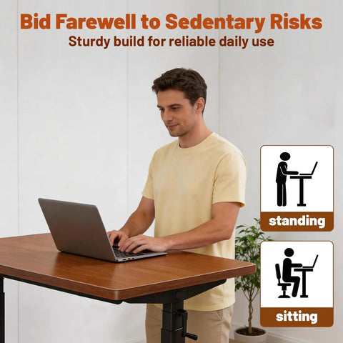 Forty Seven Inch Manual Standing Desk Heavy Duty Casters With Integrated Fast Charging Hub Usb Power Port, user standing at desk working.