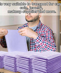Person holding purple envelope from 100 Count Bubble Mailer Set Four Sizes Self Adhesive Waterproof Padded Envelopes For Shipping And Mailing Cushioning Seal Bubble Mailers For Small Business Packaging Purple