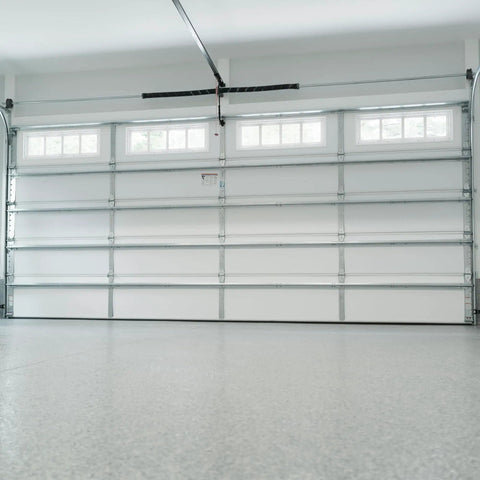 Closed garage door, featuring torsion spring setup for balance and smooth operation, ideal for easy DIY repairs at home garages.