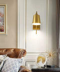 Modern Plug In Gold Wall Sconce Set Of 2 With Adjustable 180 Degree Light Heads For Bedroom And Living Room Easy Install Sleek Contemporary Look And Warm Luxe Glow mounted in elegant living room setting.