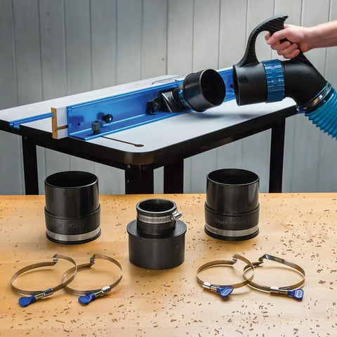 Polymer Dust Right Quick Change Multi Port Tool Set With Quick Change Handle For Dust Collection 2.5 To 4 Inch Tool Ports And 4 Inch Keyed Bridge Hose Clamps No Fuss Easy Flexible Dust Collection Setup displayed near a table saw with handles, ports, and clamps.